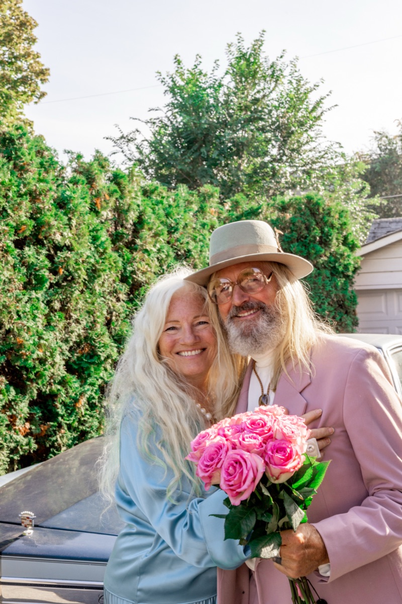- Blog A joyful older couple holding pink roses, embracing healthy aging