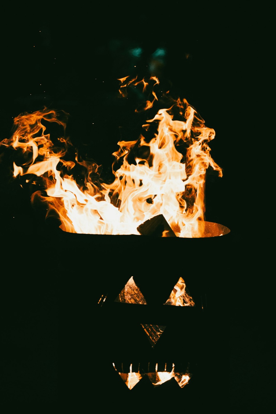 hw26 blog mgx fire lantern - Blog A fire burning above a carved jack o lantern face at night
